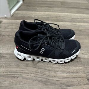 On Running Black and White Athletic Shoes with Cloud Cushioning